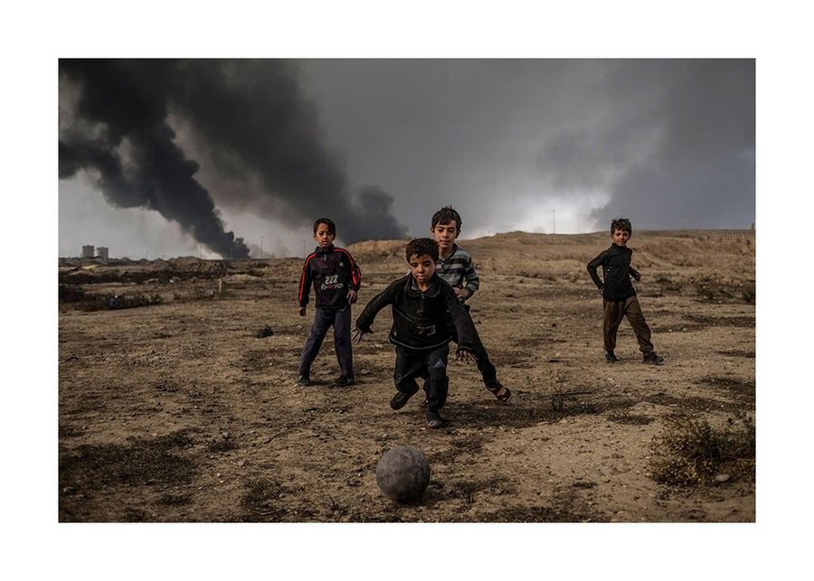 Boys playing football, Mosul 2016 - Photographic color print, stamped and signed by Jan Grarup. Printet on Baryta Fine Art 325 gram paper in A2 (59,4 x 42cm)